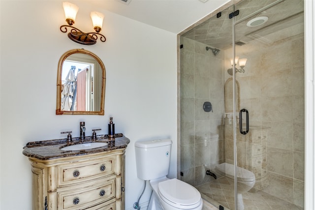 bathroom with walk in shower, vanity, and toilet