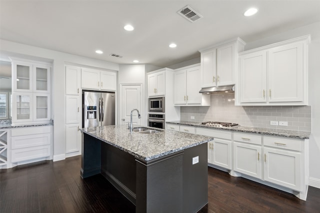 kitchen with white cabinets, appliances with stainless steel finishes, dark wood-type flooring, and sink