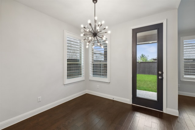 foyer featuring dark hardwood / wood-style floors and a notable chandelier