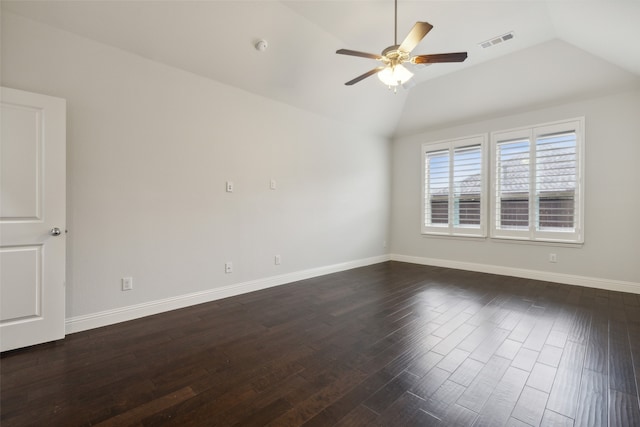 empty room featuring lofted ceiling, dark wood-type flooring, and ceiling fan