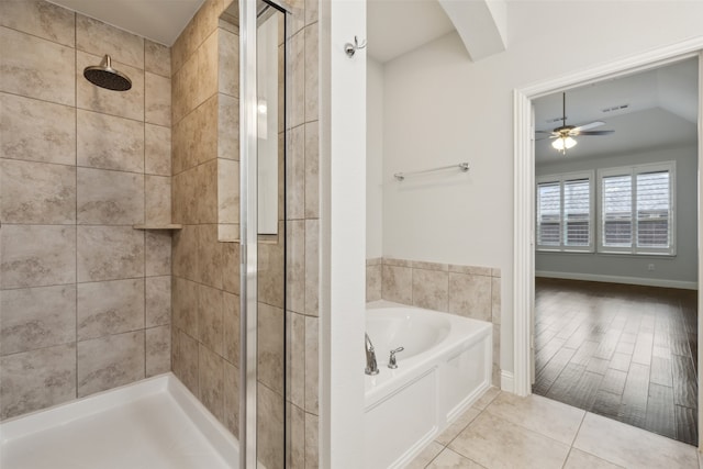 bathroom featuring ceiling fan and independent shower and bath