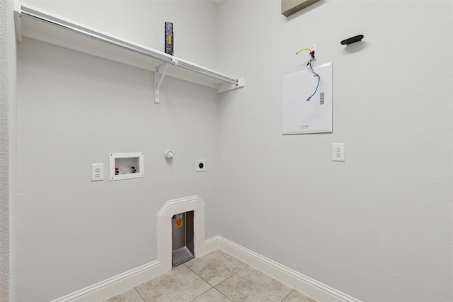 washroom featuring washer hookup, light tile patterned flooring, gas dryer hookup, and hookup for an electric dryer