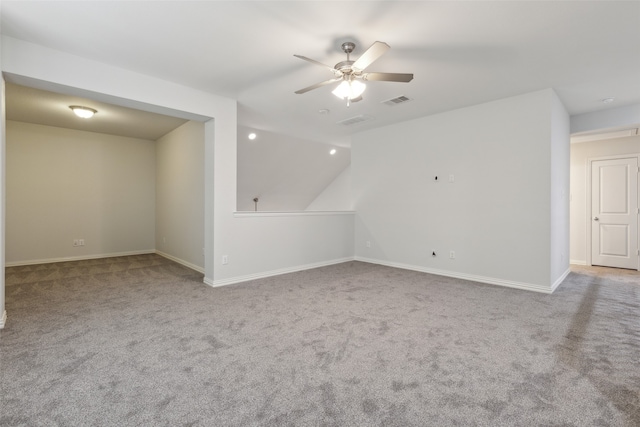 carpeted spare room with ceiling fan