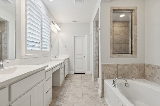 bathroom with plus walk in shower, tile patterned floors, and vanity