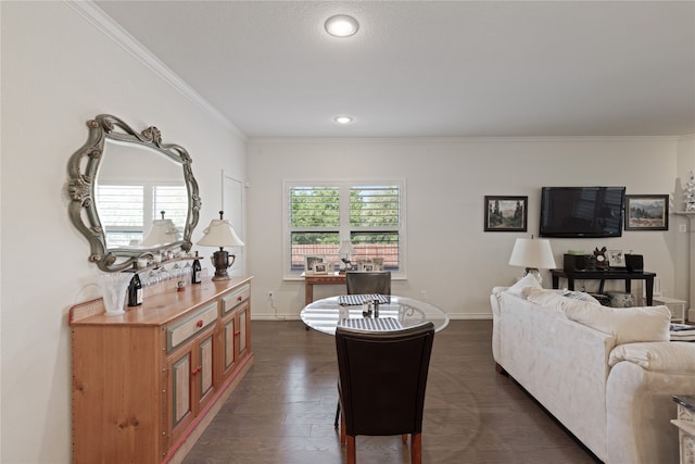 living room with dark hardwood / wood-style flooring and ornamental molding