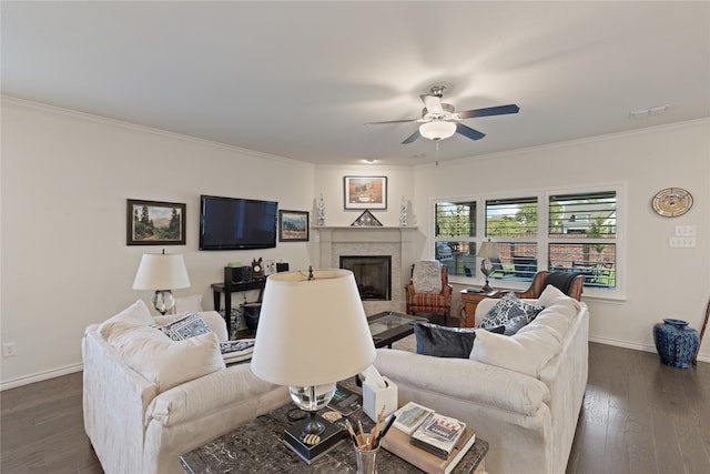 living room featuring ceiling fan, dark hardwood / wood-style flooring, and crown molding