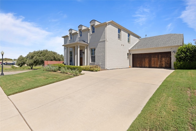 view of home's exterior featuring a garage and a lawn