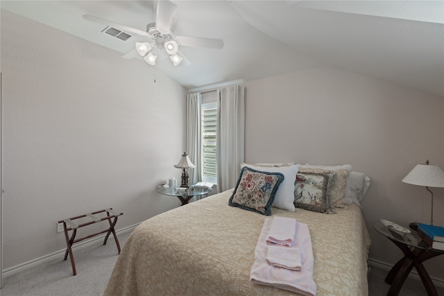 bedroom with ceiling fan, carpet floors, and vaulted ceiling