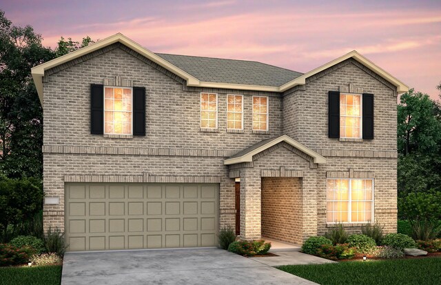 view of front of home with a garage