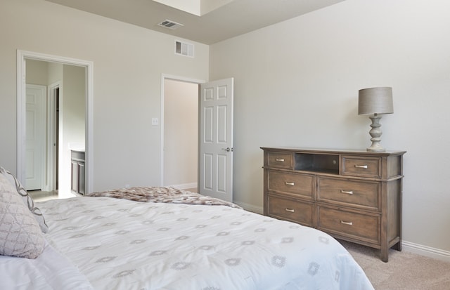 bedroom with light carpet