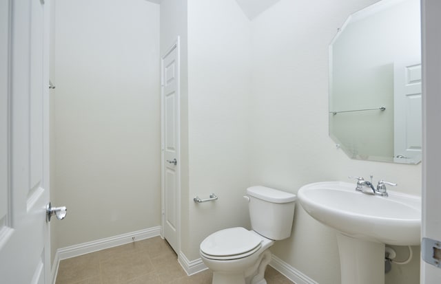 bathroom with tile patterned floors and toilet