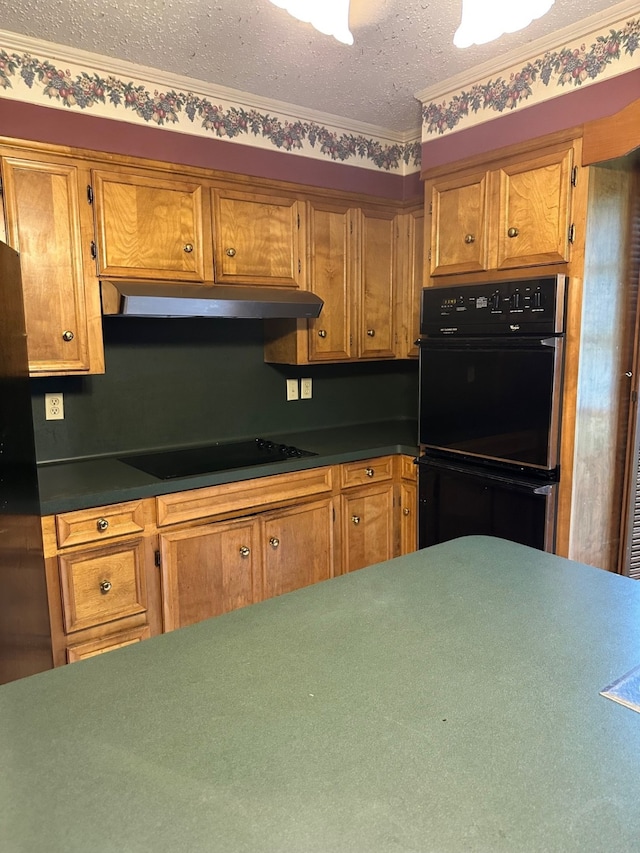 kitchen featuring black appliances, a textured ceiling, and crown molding