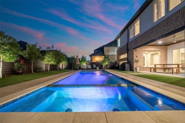 view of pool featuring a fenced backyard, a fenced in pool, and an in ground hot tub