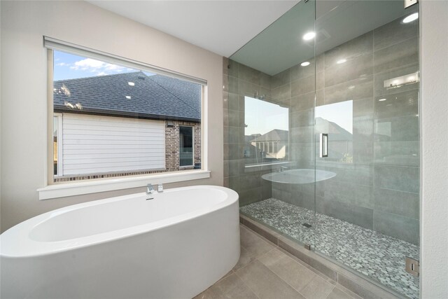 bathroom featuring tile patterned floors, vanity, and independent shower and bath