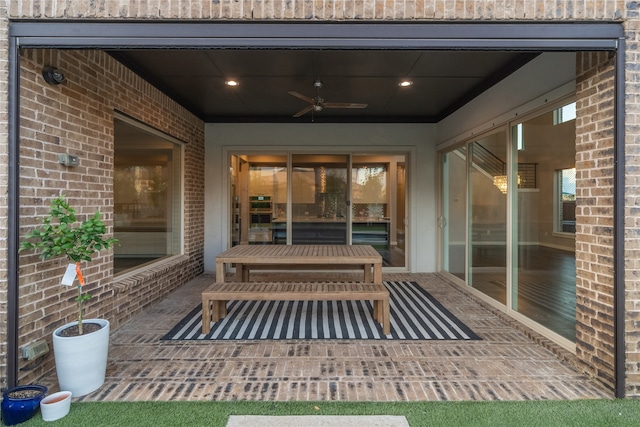 view of patio / terrace featuring ceiling fan