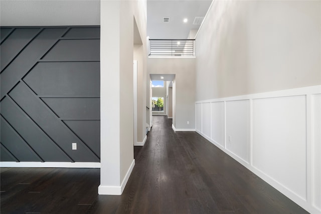 hallway featuring dark hardwood / wood-style floors