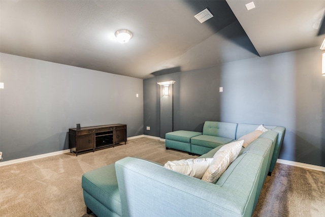 carpeted living room with visible vents and baseboards