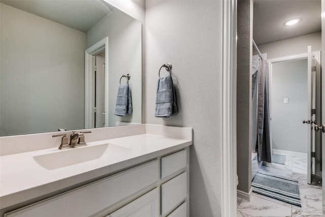 bathroom with recessed lighting, vanity, baseboards, marble finish floor, and a shower with curtain