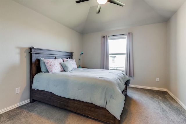 bedroom featuring dark carpet, vaulted ceiling, and baseboards