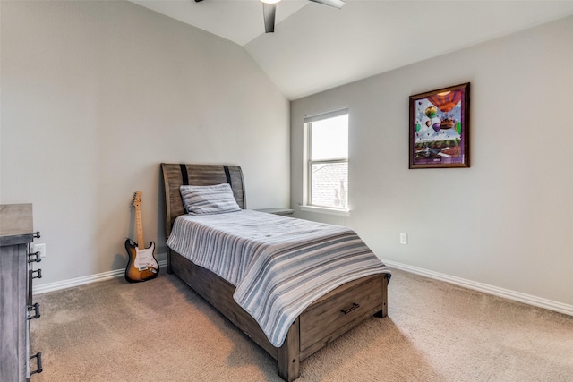 bedroom with light colored carpet, vaulted ceiling, and baseboards