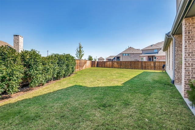 view of yard featuring a fenced backyard