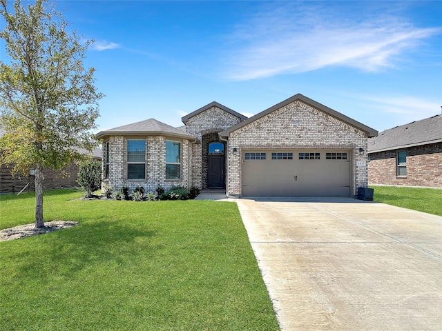 view of front of home with a front lawn and a garage