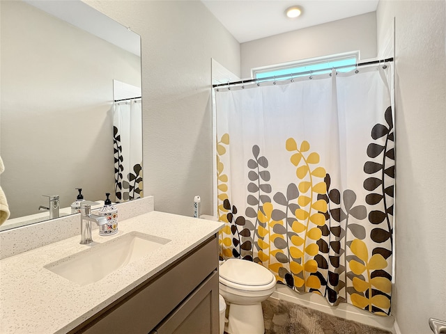 bathroom featuring vanity, toilet, and a shower with shower curtain