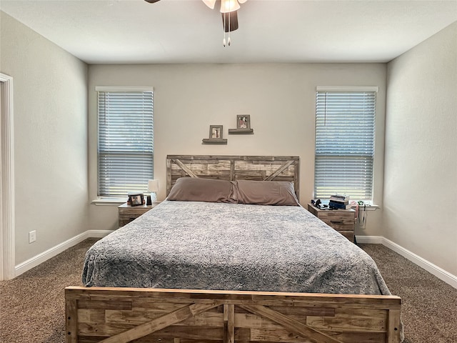 carpeted bedroom with ceiling fan and multiple windows