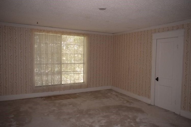 carpeted spare room featuring wallpapered walls, ornamental molding, and a textured ceiling