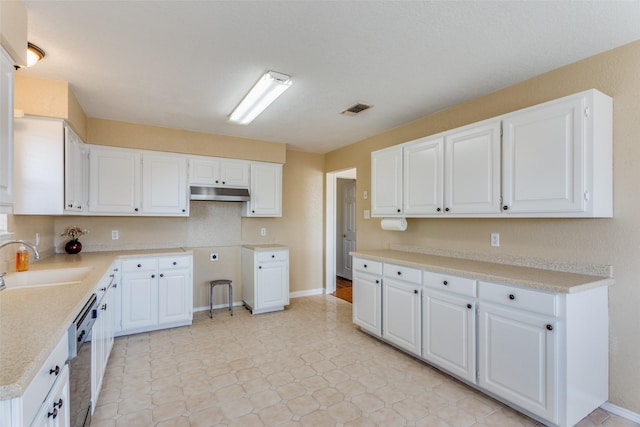 kitchen featuring dishwasher, white cabinetry, sink, and tasteful backsplash