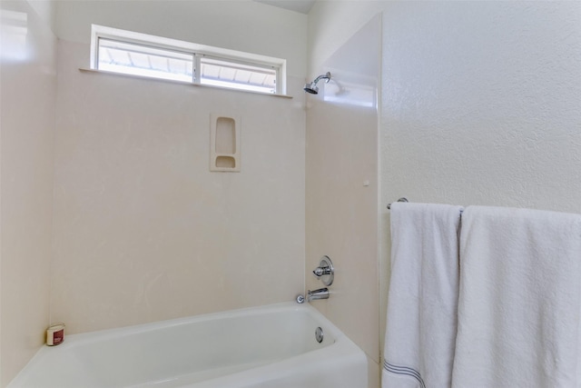 bathroom with a tub to relax in