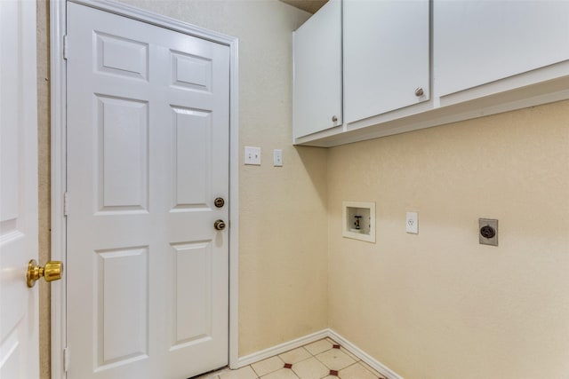 washroom featuring washer hookup, electric dryer hookup, and cabinets