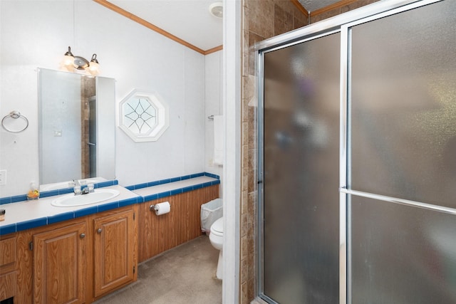 bathroom featuring toilet, vanity, crown molding, and walk in shower