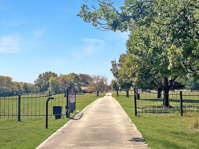 view of home's community featuring a lawn