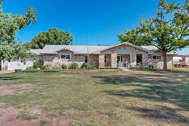 ranch-style home featuring a garage, a porch, and a front lawn