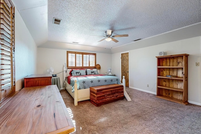 bedroom with lofted ceiling, carpet, ceiling fan, and a textured ceiling