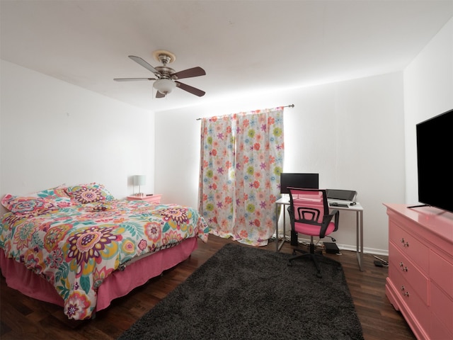 bedroom featuring dark hardwood / wood-style flooring and ceiling fan