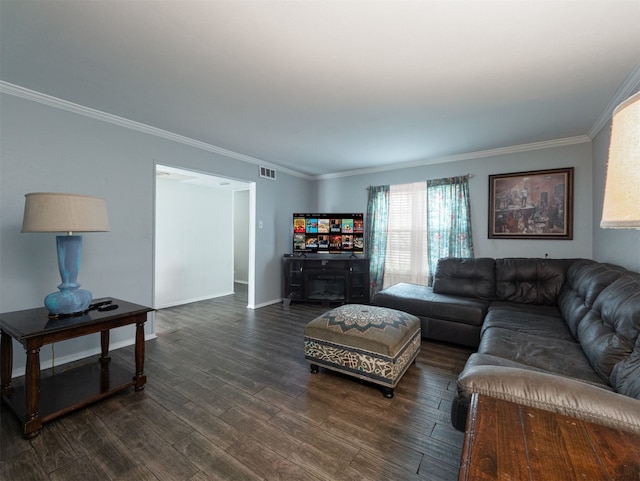 living room with ornamental molding and dark hardwood / wood-style flooring