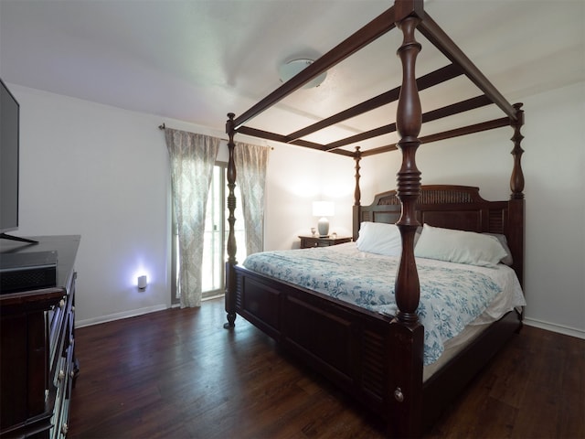 bedroom featuring dark hardwood / wood-style flooring