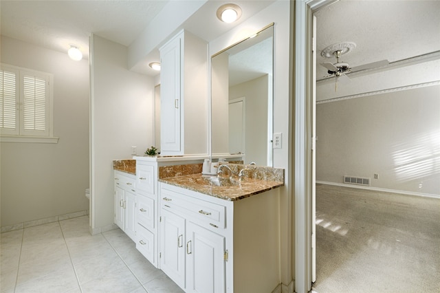 bathroom featuring vanity, tile patterned flooring, toilet, and ceiling fan