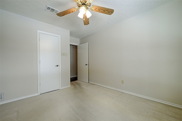 unfurnished bedroom with a textured ceiling and ceiling fan