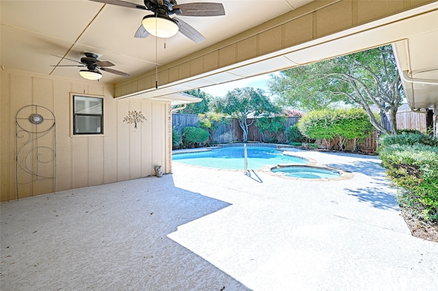 view of swimming pool with an in ground hot tub, a patio, and ceiling fan