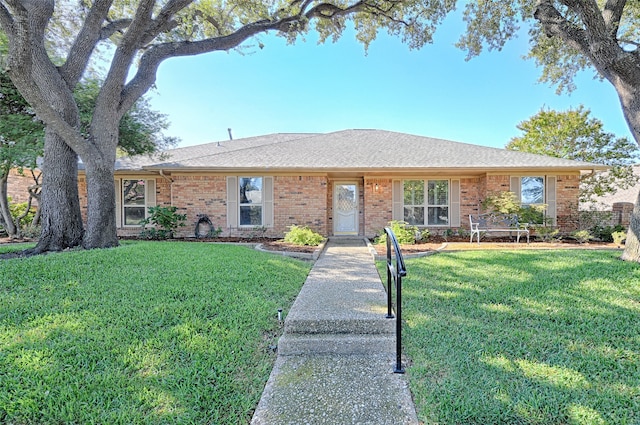 ranch-style home with a front lawn