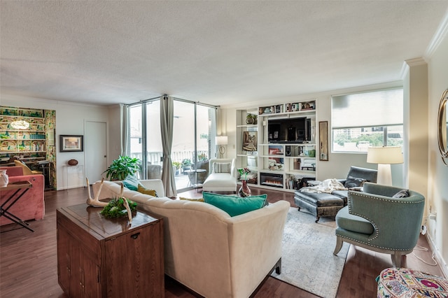 living room with a textured ceiling, crown molding, and hardwood / wood-style floors