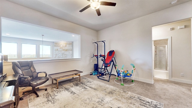 interior space featuring ceiling fan and carpet floors