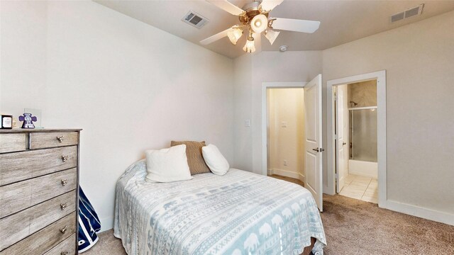 bedroom featuring multiple windows, connected bathroom, ceiling fan, and carpet floors