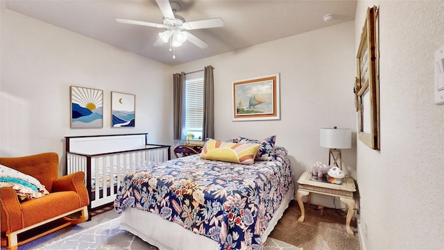 carpeted bedroom featuring ceiling fan