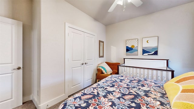 bedroom featuring ceiling fan, a closet, and carpet flooring