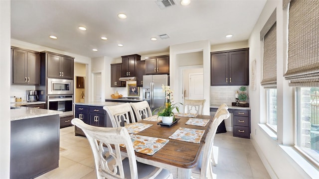 dining room featuring light tile patterned floors