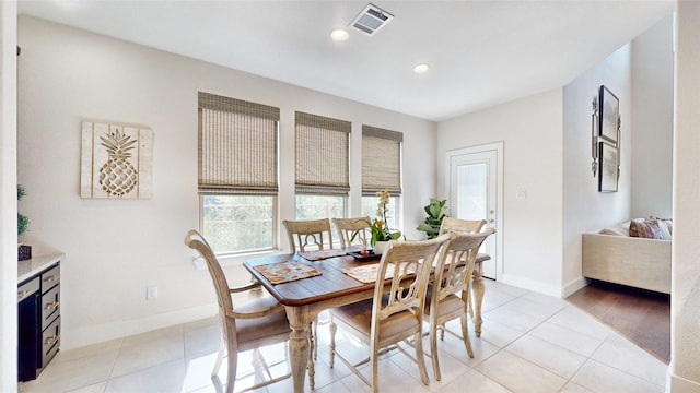 dining area with light tile patterned flooring